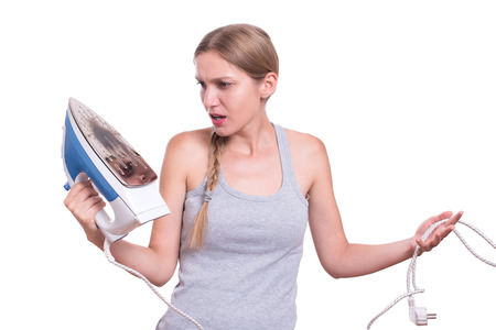 Shocked Woman With Burned Ironの写真素材