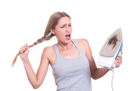 Shocked Woman With Burned Ironの写真素材