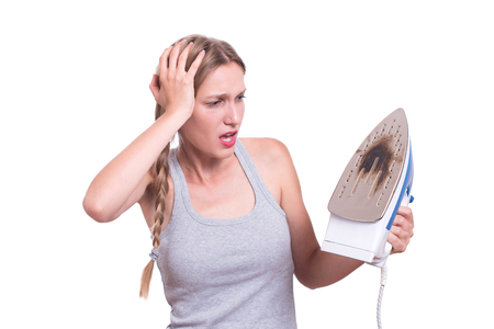 Shocked Woman With Burned Ironの写真素材