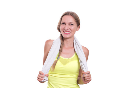 Smiling happy female fitness model looking at cameraの写真素材