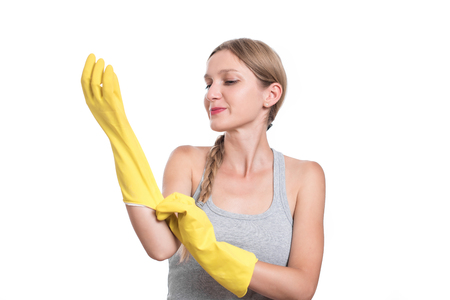 Woman ready for cleaning with rubber gloves and smilingの写真素材