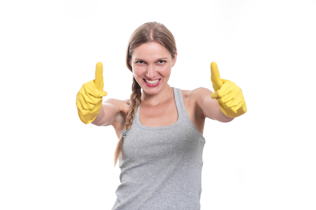 Woman ready for cleaning with rubber gloves and smilingの写真素材