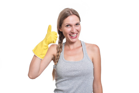 Woman ready for cleaning with rubber gloves and smilingの写真素材