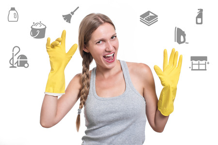 Woman ready for cleaning with rubber gloves and smilingの写真素材