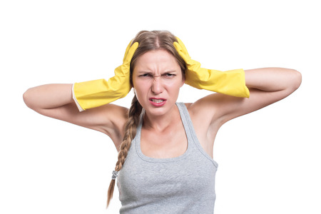 Tired and frustrated cleaning woman screamingの写真素材