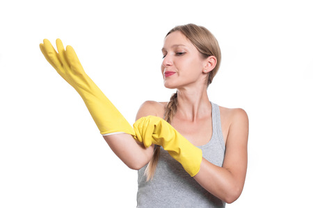 Woman ready for cleaning with rubber gloves and smilingの写真素材