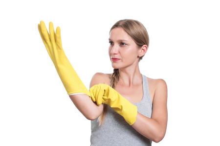 Woman ready for cleaning with rubber gloves and smilingの写真素材