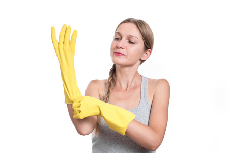 Woman ready for cleaning with rubber gloves and smilingの写真素材