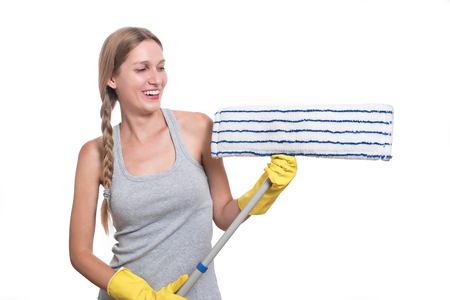 Cleaning concept. Woman with floor mop and yellow rubber glovesの写真素材