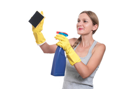 Young housewife woman cleaning, isolated on white backgroundの写真素材