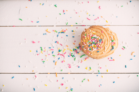 Birthday cookies on white wooden tableの写真素材