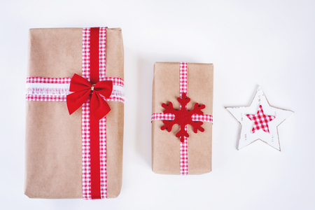 Wrapped vintage gift boxes with red ribbon bowの写真素材
