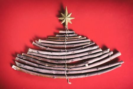 Christmas tree made of wooden branchesの写真素材