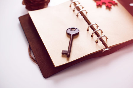 Vintage Notebook of leather cover with antique keyの写真素材