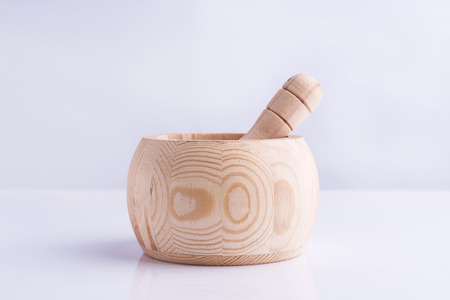 Wooden spice bowl on white backgroundの写真素材