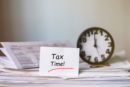 Tax Time Concept! Clock and Taxes Due reminderの写真素材