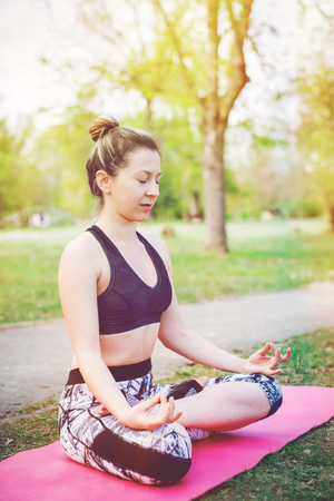 Young woman practicing yogaの写真素材