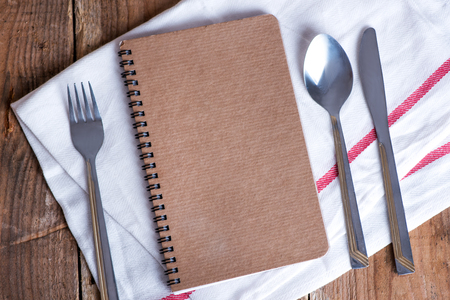 Blank recipe book on wooden tableの写真素材