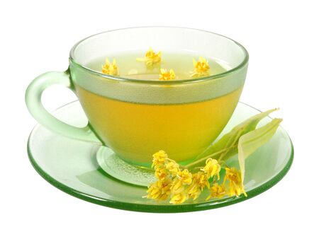 Cup of linden tea and flowers isolated on whiteの写真素材