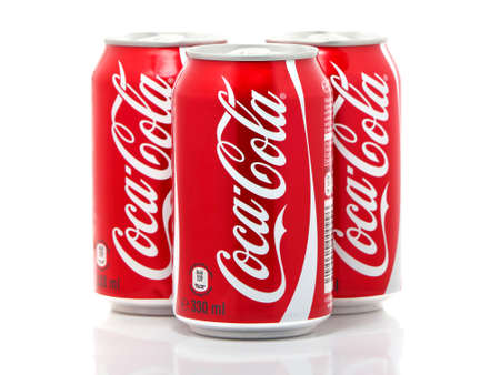 BUCHAREST, ROMANIA - DECEMBER 22, 2016. Cans of Coca-Cola isolated on white background. Coca-Cola is produced by The Coca-Cola Company and is often referred to simply as Cokeのeditorial素材