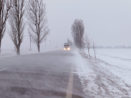 Road under the blizzard, snowstorm in winter