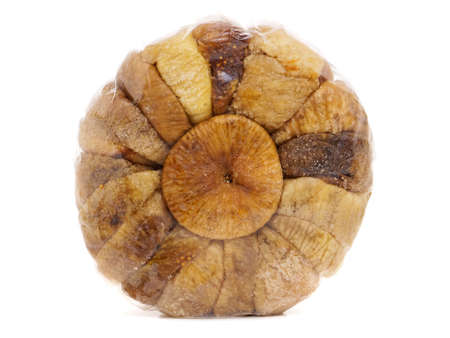 Round package of dried figs isolated on whiteの写真素材