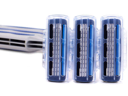 Disposable razors with three blades isolated on whiteの写真素材
