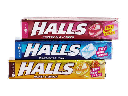 BUCHAREST, ROMANIA - APRIL 5, 2015. Halls Mentho-Lyptus, Cherry Flavoured and Honey and Lemon. Halls is the brand of a popular mentholated cough dropのeditorial素材