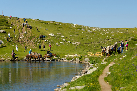 RILA MOUNTAIN, BULGARIA - August 02, 2015 : Lot of tourists at one of the seven Rila lakesのeditorial素材