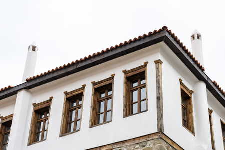 Old traditional house with white chimneys in Melnik, Bulgaria isolated on whiteの写真素材