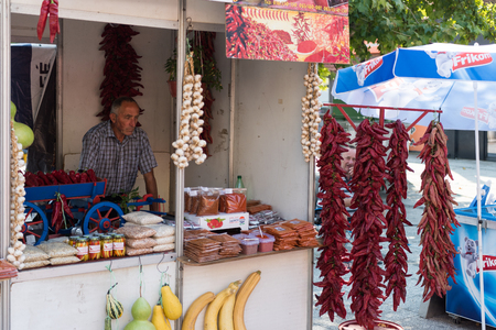 LESKOVAC, SERBIA - 02 September 2017 : Elderly man selling pepper at market stand on the streets of Leskovacのeditorial素材