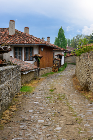 A street in Zheravna village (Municipality of Kotel) with old traditional houses, Bulgariaの写真素材