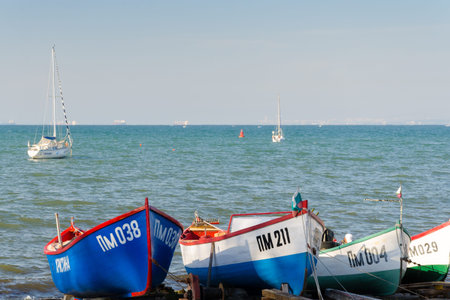 Pomorie, Bulgaria - September 20, 2014: Row of blue fishing boats moored at the harbor of Pomorieのeditorial素材