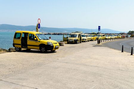 Nesebar, Bulgaria - July 07, 2017: Row of taxis in a taxi rank awaiting for customersのeditorial素材