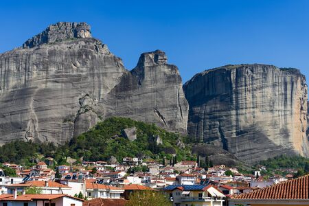 Kalambaka, Greece - April 16, 2017: Classical Greek houses and cloudless sky over Kalabaka village situated on the foot of boulder rocks of Meteoraのeditorial素材