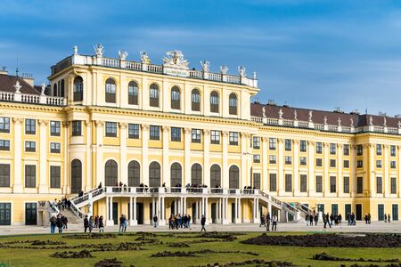 Vienna, Austria - December 31, 2017: The garden park in Shonbrunn Palace (Wien) prepared for the winter with missing flowers and large groups of tourists walking aroundのeditorial素材