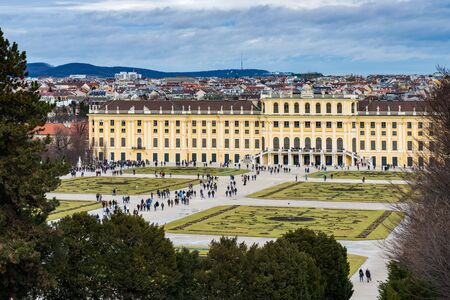 Vienna, Austria - December 31, 2017: The garden park in Shonbrunn Palace (Wien) prepared for the winter with missing flowers and large groups of tourists walking aroundのeditorial素材