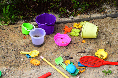 A sandpit with the plastic toysの写真素材
