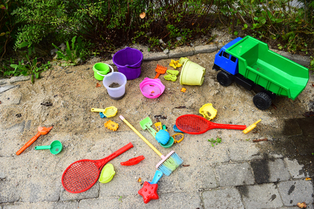 A sandpit with the plastic toysの写真素材