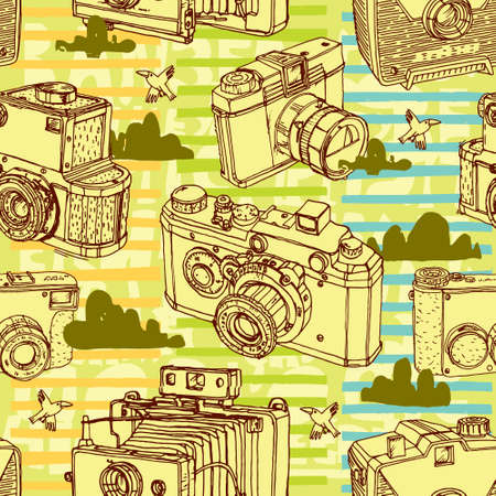 Seamless pattern with vintage cameras and clouds. Vector illustration.のイラスト素材