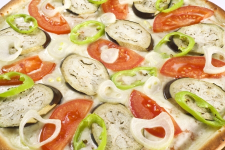 pizza with vegetables, ham, and mushrooms isolated on whiteの写真素材