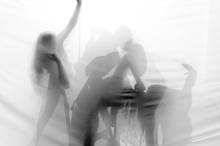 Group of contemporary dancers performing on stage 