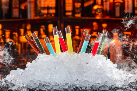 colorful cocktails in a test tubeの写真素材