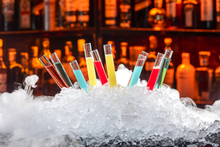 colorful cocktails in a test tubeの写真素材