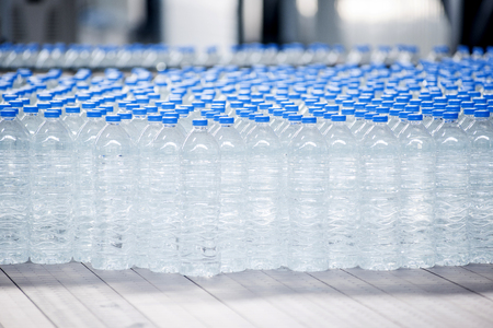 Curves of many water bottles holding fresh, clean waterの写真素材