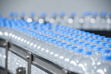 Curves of many water bottles holding fresh, clean waterの写真素材
