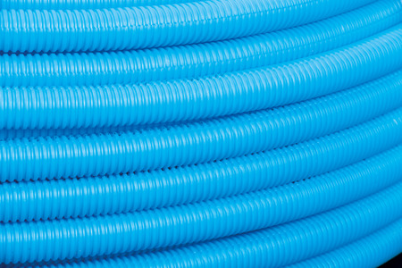 Bunches of PVC pipe sitting on palets at a wholesale pipe store.の写真素材