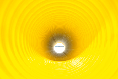 Bunches of PVC pipe sitting on palets at a wholesale pipe store.の写真素材