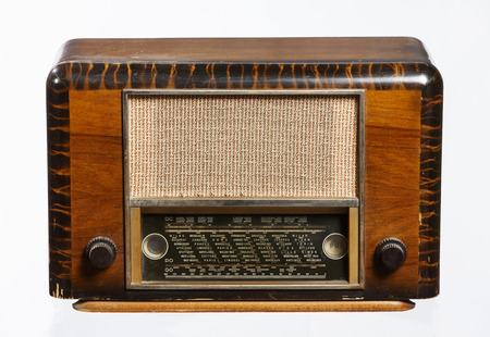 An old retro-style radio from the 1950's isolated on white background.の写真素材