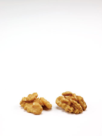Chopped ripe walnut isolated on white background
